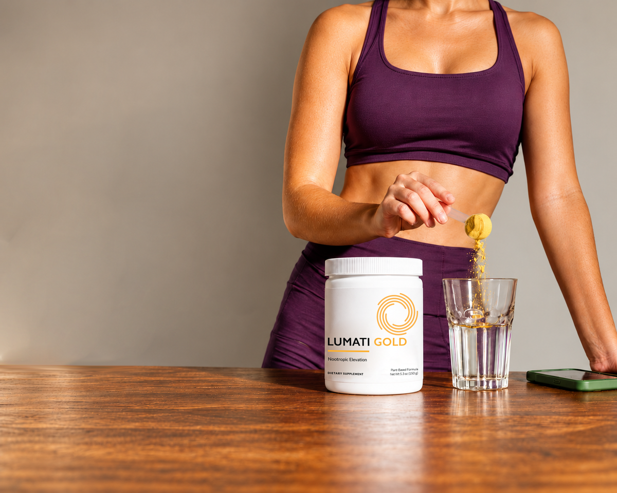 Woman in a purple sports top standing at a wooden table with a tub of Lumati Gold and a glass of water.